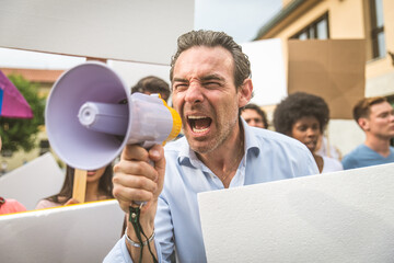 Public demonstration on the street against social problems and human rights. Group of multiethnic...