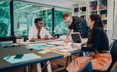 Active group of multiethnic employees discussing project
