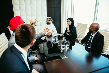 Mixed business team making agreements on future business plans. in the office