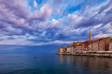 Naklejka premium Wonderful morning view of old Rovinj town with multicolored buildings and yachts moored along embankment, Croatia.