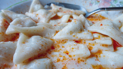 Traditional Turkish cuisine Ravioli, Manti Manlama serving with yogurt and fried butter sauce. 