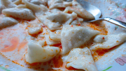 Traditional Turkish cuisine Ravioli, Manti Manlama serving with yogurt and fried butter sauce. 