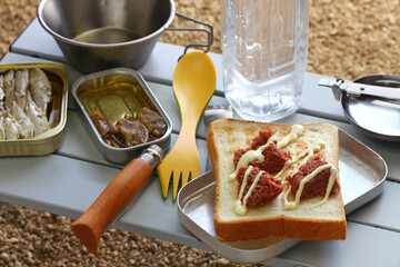 camping cooking. corned beef on toast