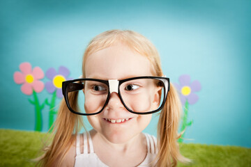 Happy Nerdy Little Girl in Imaginary Outside Wonderland World