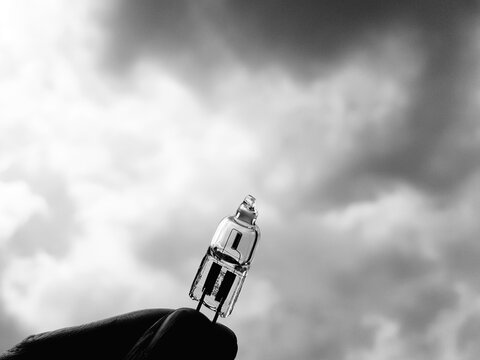 Low Angle View Of  Halogen Lightbulb Against Sky