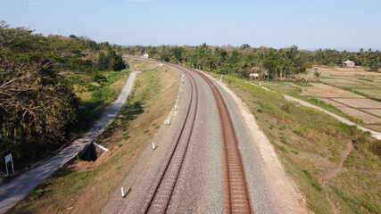 Fototapeta na wymiar aerial view of railroad tracks across the countryside