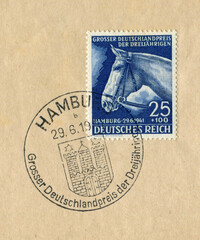 Hamburg, GERMANY — 29 September 1941: Historical stamp: Head of a riding horse, German championship in horse racing "Blue ribbon", first day special cancellation
