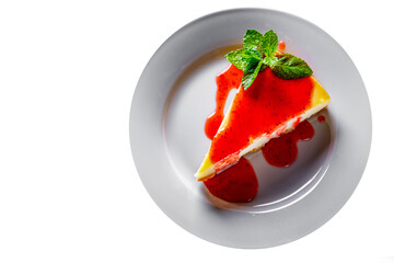 Strawberry cheesecake served on white plate isolated on white background