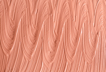 Pale pink cosmetic clay (beige alginate facial mask, face cream, body wrap) texture close up,...