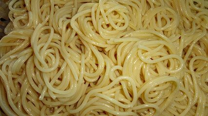 A large bowl with freshly cooked sphaghetti closeup	