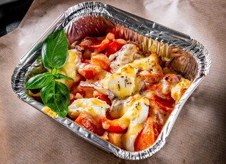 Baked vegetables and feta cheese in a baking dish