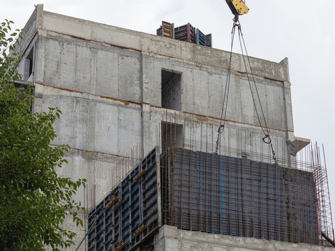 Construction Of A Wall Of A Multi-Storey Building Using The Sliding Formwork Method. The Crane Holds The Formwork Shield