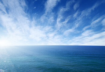 Naklejka na ściany i meble Blue sea with waves and sky