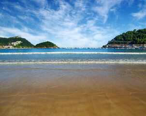 Sand beach and ocean in the bay
