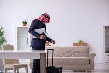 Old arab businessman preparing for business trip