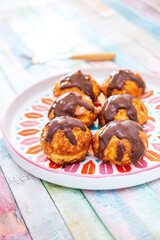 Profiterole with vanilla and chocolate sauce
