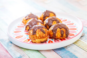 Profiterole with vanilla and chocolate sauce