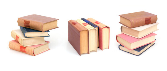 Stack of books in colour covers with white sheets isolated on a white background