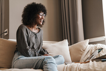 Happy african-american woman making video call