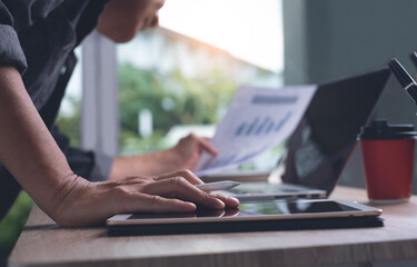 Business man reviewing financial report while busy working in office for business analysis concept