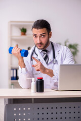 Young male doctor working in the clinic