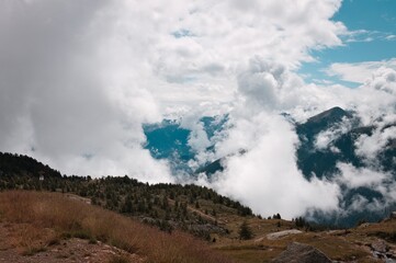 Cloudscape in the Alps with mountains in background (Peio, Trentino, Italy, Europe)
