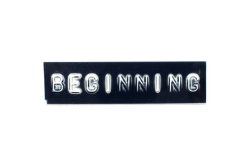 Embossed letter in word beginning on black banner with white background