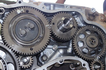 The mechanic is checking the engine.