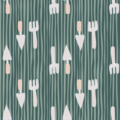 Simple seamless pattern with grey garden tool silhouettes. Green stripped background. Shovel and rake ornament.