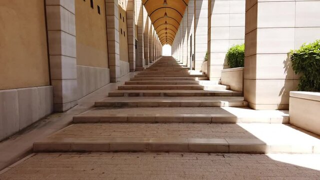 fast walking under the arcades on long archway corridor hyperlapse in San Giovanni Rotondo - Apulia - Italy