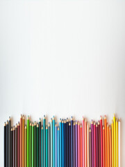 Colored pencil stacked systematically on white background