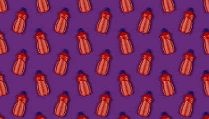 background texture pattern with orange plastic bottles with dishwashing detergent on purple backdrop