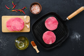 Top view of round tuna cutlet for burger or frying