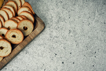 Bread, round crackers on a wooden stand with sauces. Ready meal from the menu. Snack.