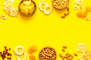 Frame of nuts overhead with dried fruits and other snacks top view