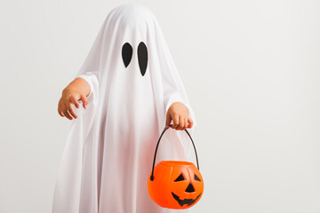 Funny Halloween Kid Concept, little cute child with white dressed costume halloween ghost scary he...