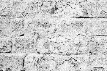 Texture of a brick wall with cracks and scratches which can be used as a background
