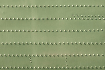 Military metal steel texture with lots of rivets.