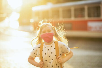 modern girl coming back from school outside