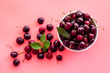 Berries in the bowl. Red cherry top view, copy space
