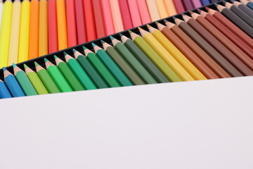 Various colored pencils on white background