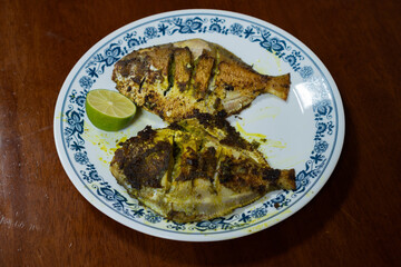 Fried fish served on a plate