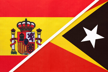 Spain and East Timor, symbol of two national flags from textile. Partnership between European and Asian countries.