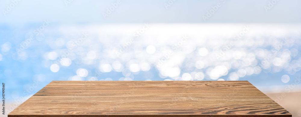 Aufkleber summer background.Empty perspective wood table with blur sea and sky bokeh background, banner mockup template for display of product