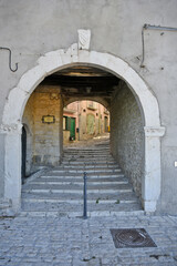 Obraz premium A narrow street among the old houses of Sepino, a medieval village in the Molise region.