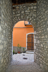 A narrow street among the old houses of Sepino, a medieval village in the Molise region.