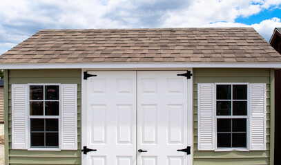 storage with vinyl windows and white door small