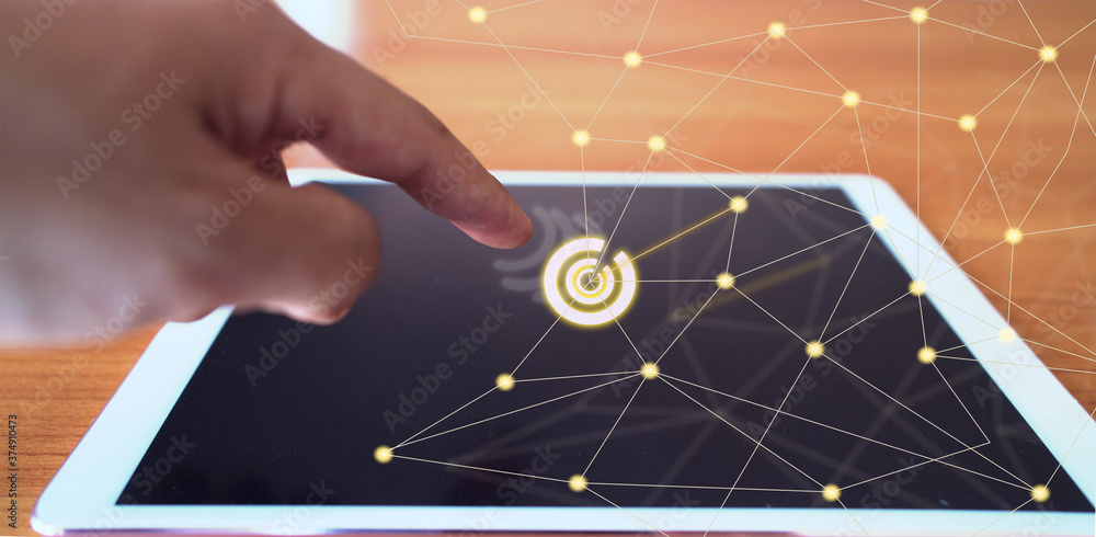 Aufkleber finger touch tablet with the concept of internet network technology connection.