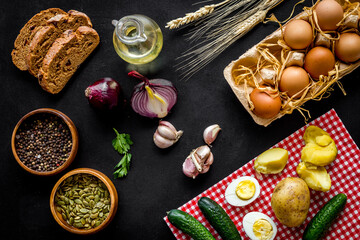 Above view of country dinner table with effs, bread, potatoes