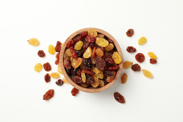 Bowl with raisins on white background, top view